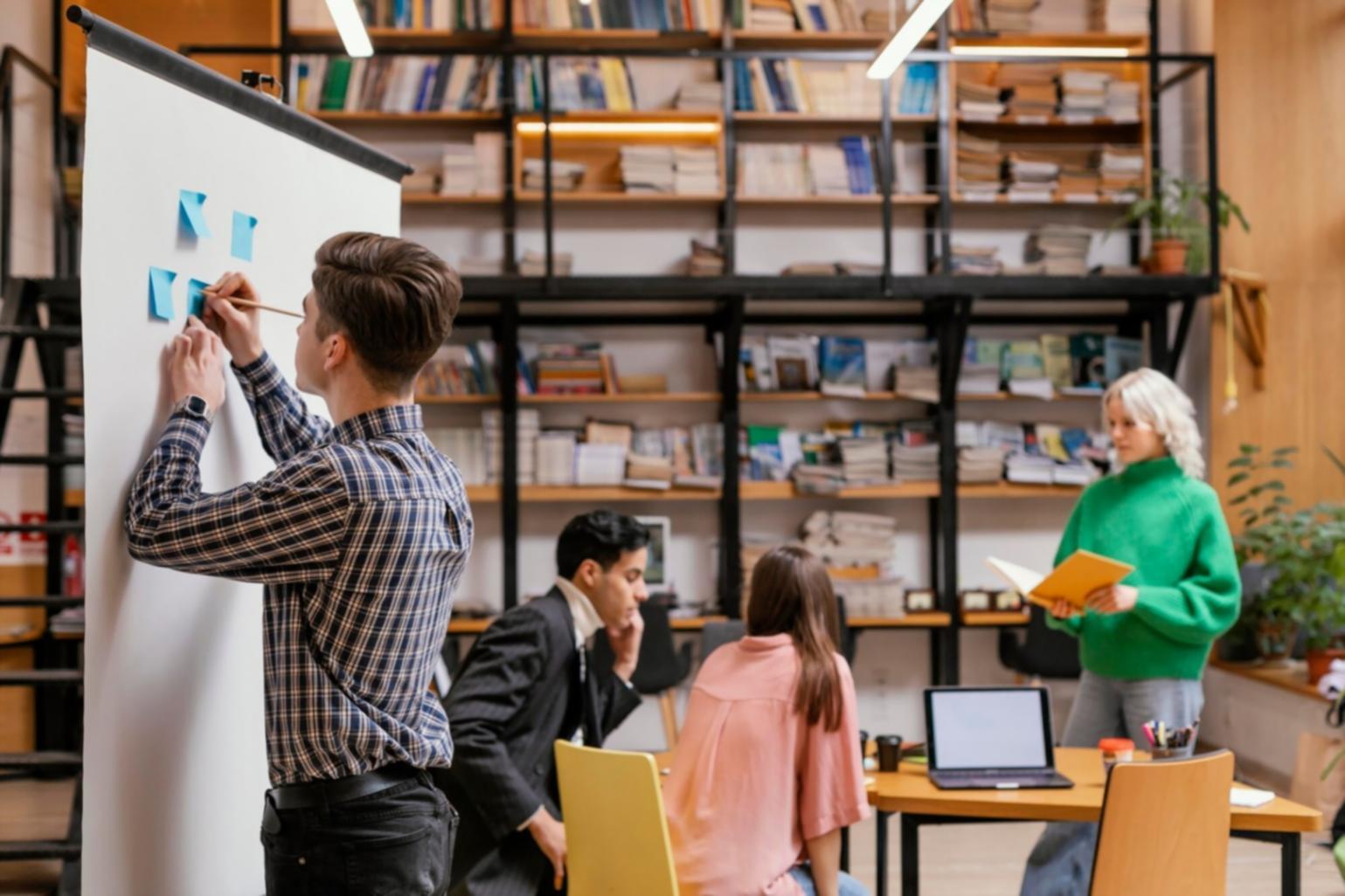 Startup founders collaborating during fundraising workshop session